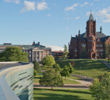 Arial view of Crouse College, Maxwell Hall, and Newhouse III in the summertime
